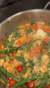 Creamy garlic chicken skillet with green beans, tomatoes and feta cheese